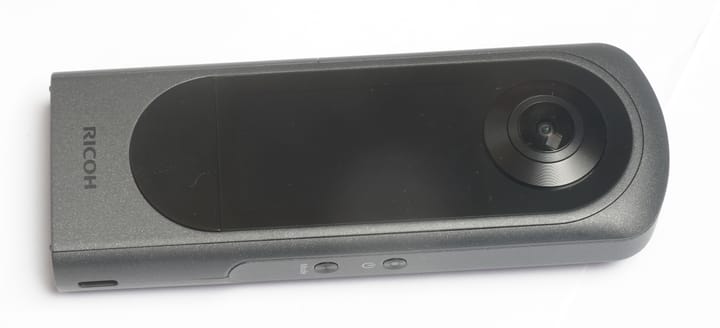 Ricoh Theta X showing lenses, screen and controls