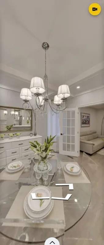 Dining-room panorama in a narrow GoThru-hosted mobile tour view with a navigation arrow.